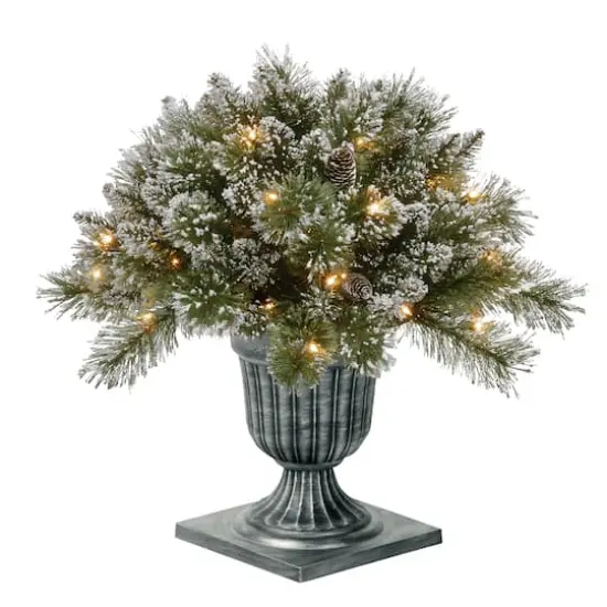24" Glittery Bristle® Pine Porch Bush in Dark Bronze Plastic Urn with White Tipped Cones {1}