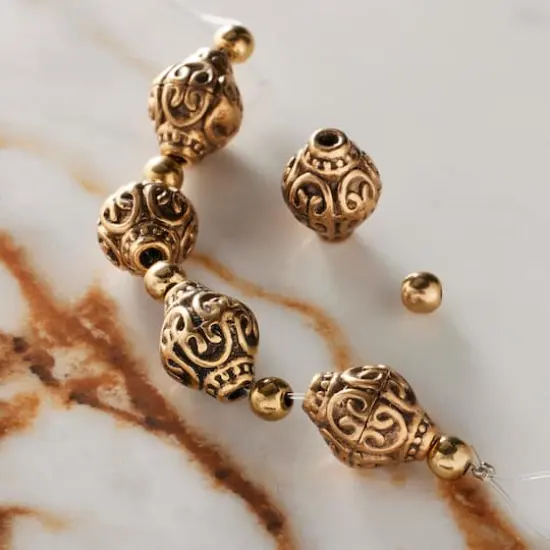 Antique Gold Metal Bicone Beads by Bead Landing&trade; {3}