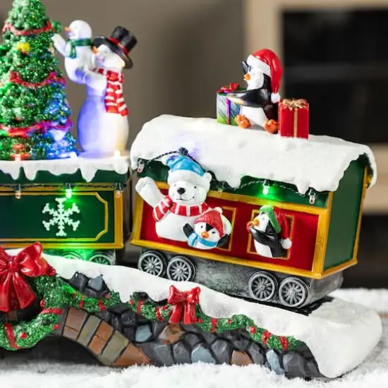 Glitzhome&reg; 20" Lighted Christmas Santa Train Resin Village with Movement and Music {7}