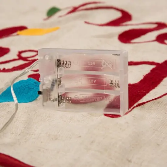 Glitzhome&reg; LED Reindeer Stockings & Tree Skirt Set {9}