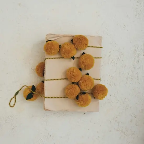 Hello Honey&reg; 6ft. Mustard Pom Poms with Green Felt Leaves Garland {5}