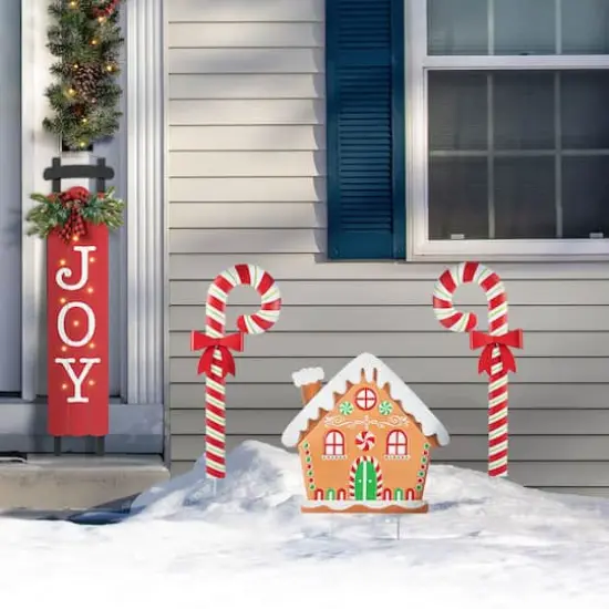 Glitzhome&reg; 33" Metal Christmas Gingerbread House and Candy Cane Yard Stake Set {4}