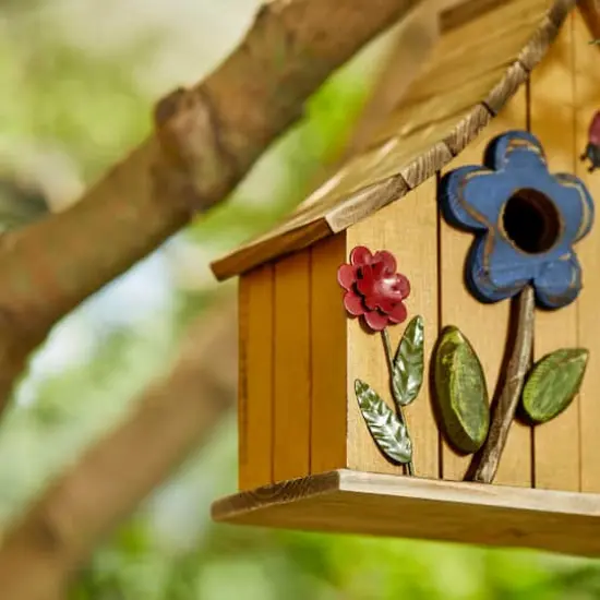 Glitzhome&reg; 10.5" Yellow Distressed Wood Birdhouse with Flowers {6}