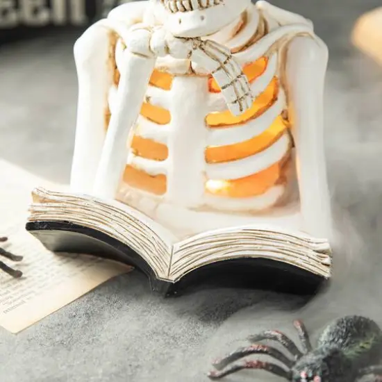 Glitzhome&reg; 10" Lighted Halloween Resin Skull Reading Book Table D&eacute;cor {7}