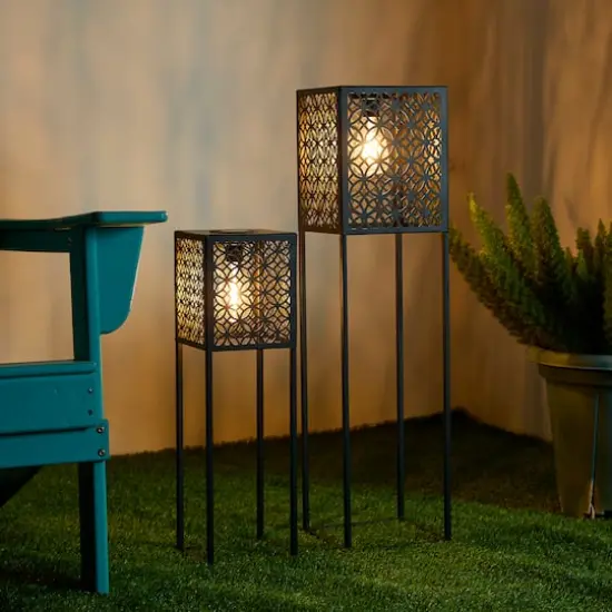 Glitzhome&reg; Black Metal Cutout Pattern Solar Powered Outdoor Floor Lanterns Set {4}