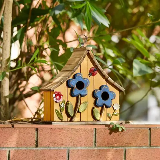 Glitzhome&reg; 10.5" Yellow Distressed Wood Birdhouse with Flowers {8}